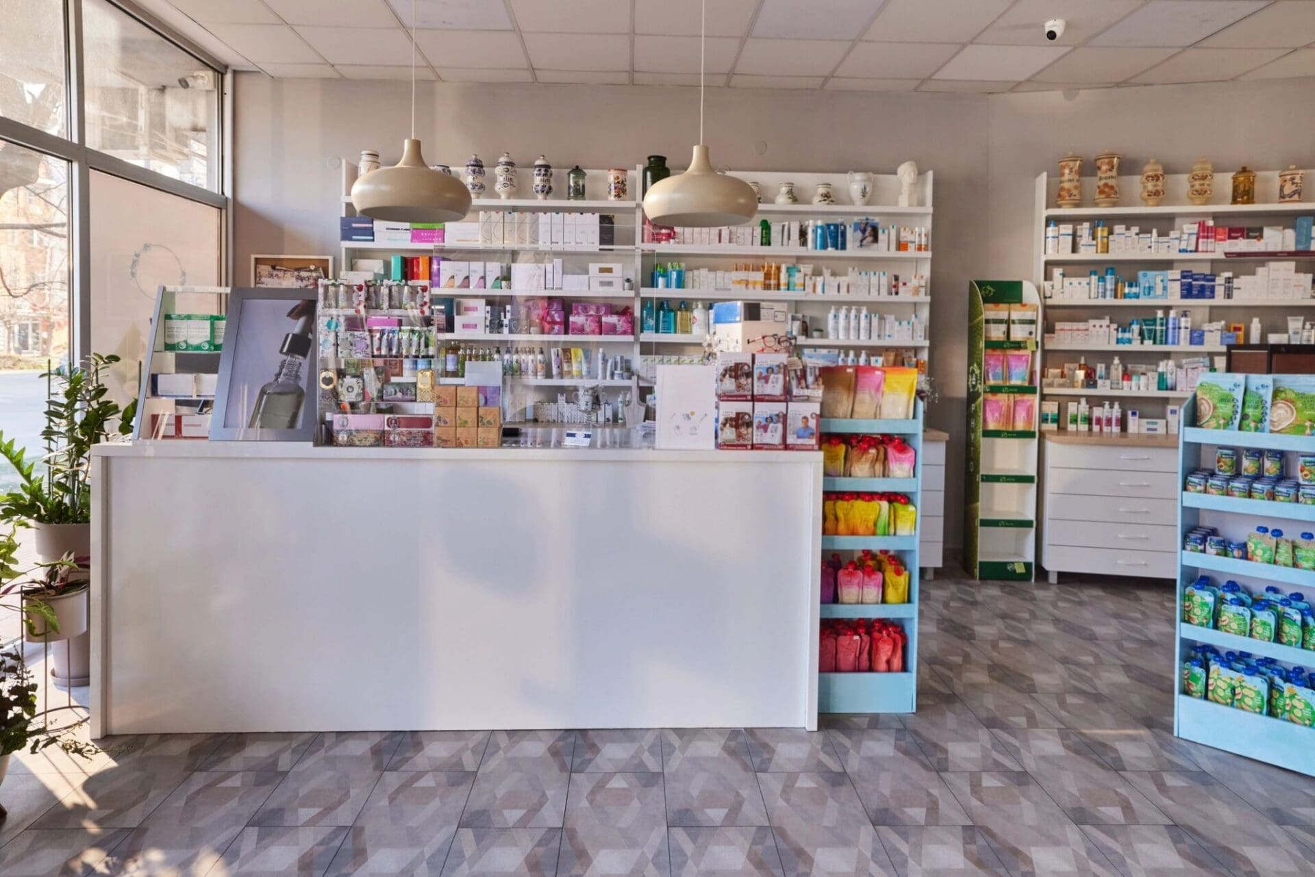 Bright, organized pharmacy interior with stocked shelves and a clean counter.