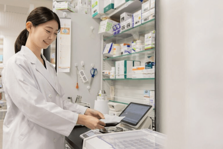 A pharmacist processing medication in a pharmacy.
